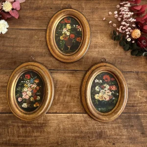 Guirlande lumineuse Bouquets de fleurs peints fond noir cadre ovale doré en bois Bouquet