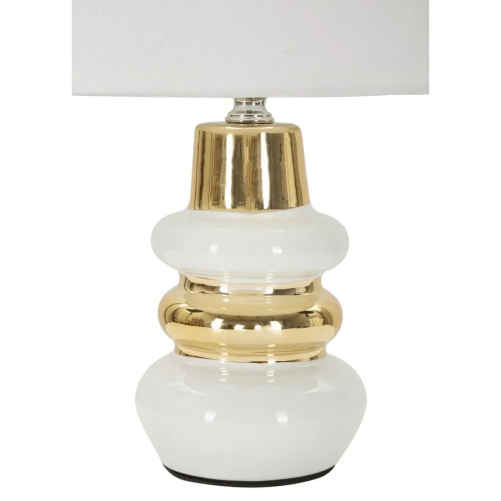 Lampe de table en céramique blanche et dorée au design aux courbes douces Mauro Ferretti